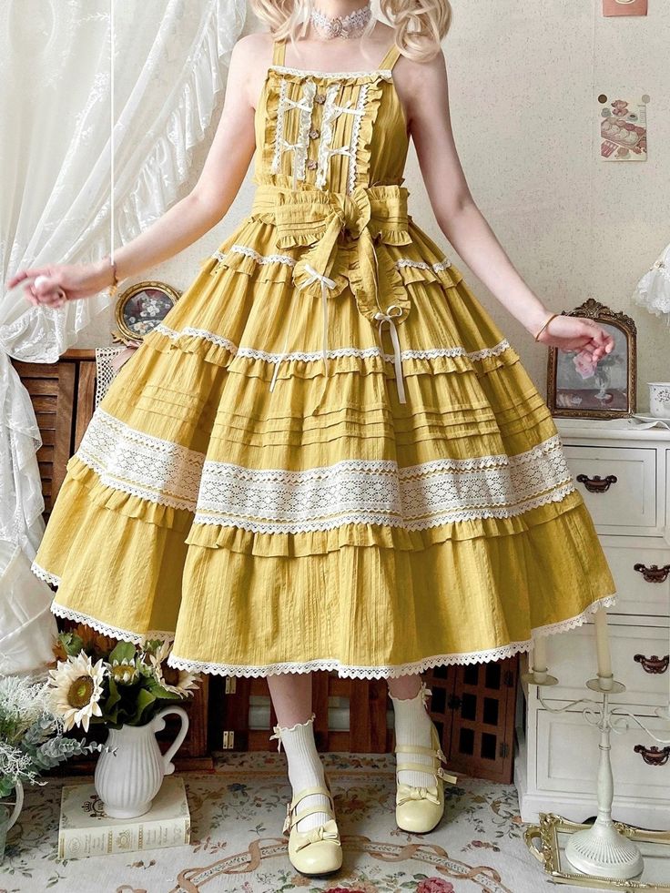 a young woman poses in a sunny yellow lolita fashion dress. the dress features multiple tiers of ruffles, delicate lace trim, and a bow at the waist. the scene is set in a room with vintageinspired furniture and decor, contributing to the overall aesthetic of the image.