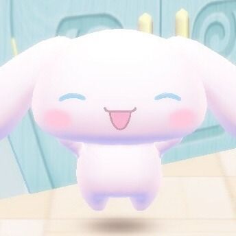 a pink and white cartoon character with big eyes and a cheerful smile. the character is standing in a cute pose and appears to be a plush toy.