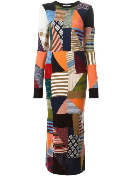 a longsleeved dress with a patchwork design, featuring a variety of colors and patterns in a knitwear material.