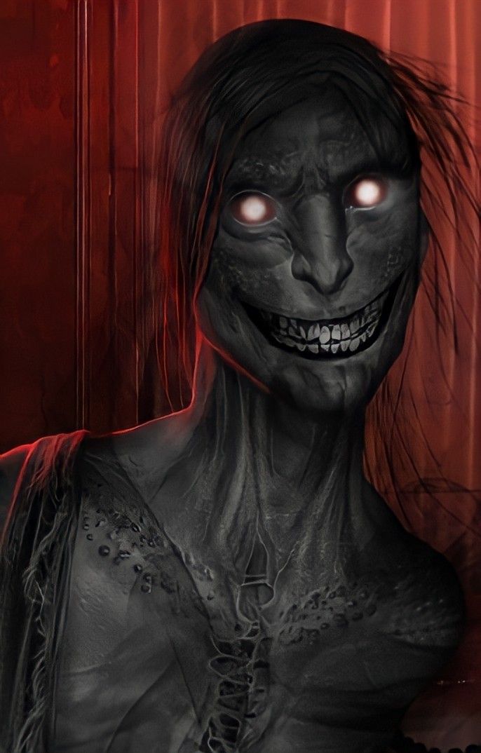 a closeup of a terrifying creature with glowing red eyes and a wide, toothy grin. the creature's skin is dark and wrinkled, and its hair is long and black. it appears to be standing in a shadowy room. the background is red, with a dark figure behind the creature.