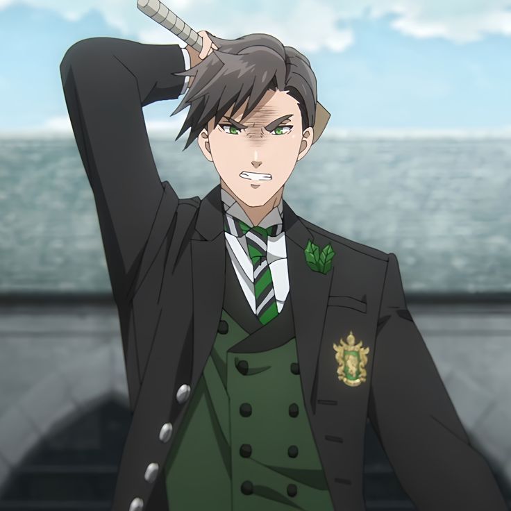 the image shows an anime character in a black suit with a green vest and tie. he is looking at something in front of him with an angry expression. he is wearing a pin on his suit that is green, gold, and black. there is a cloudy sky in the background. the character is in a gray building. he has a stick above his head as if he is going to hit something.