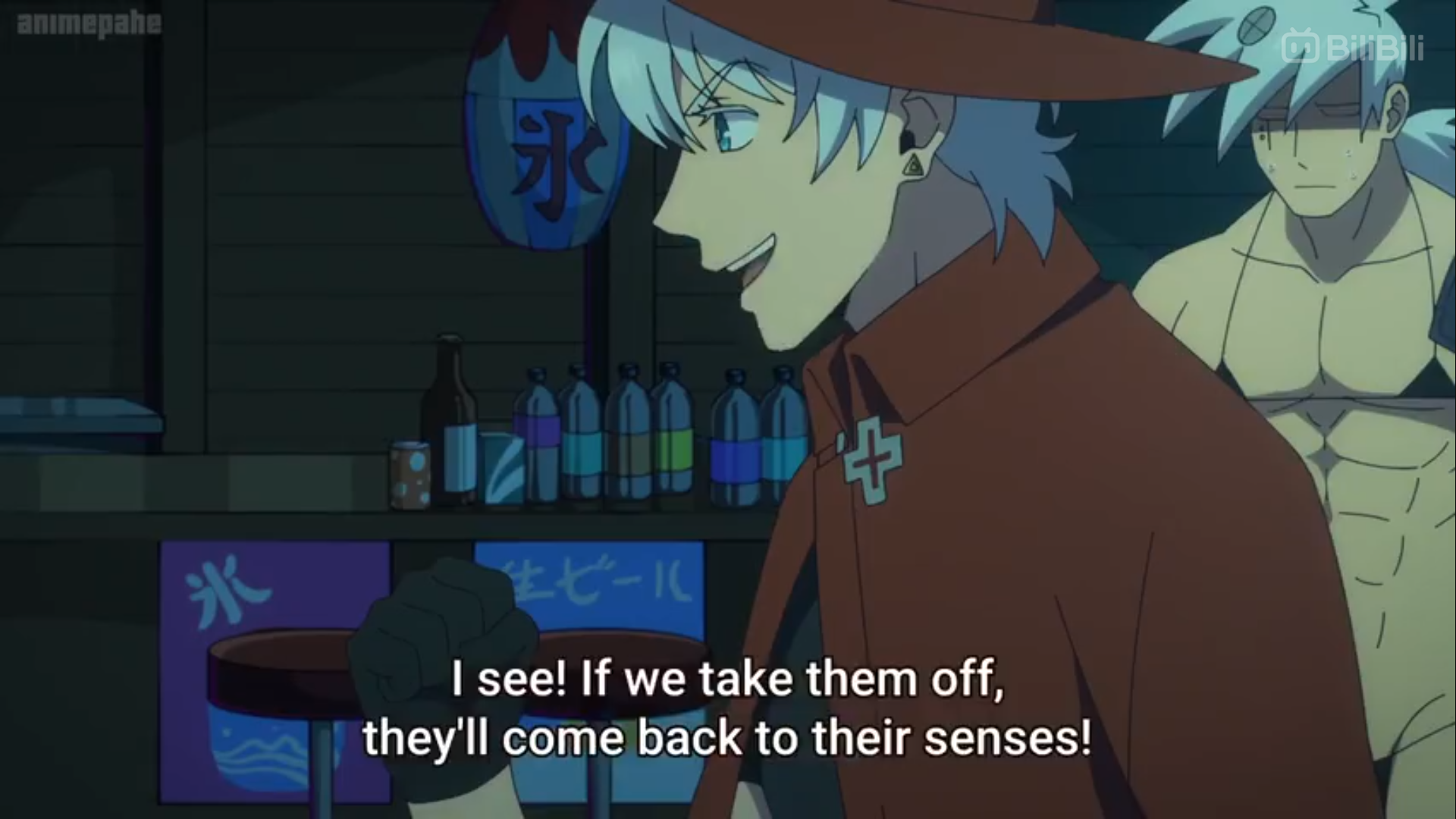 the image is a screenshot from an anime or manga. it shows two men in a room. the man in focus has white hair and is wearing a red hat and cape. he is smiling and appears to be explaining something. the man in the background is out of focus and has his back to the camera. the room is dark and lit by artificial light. there is japanese text on the wall behind the men.```