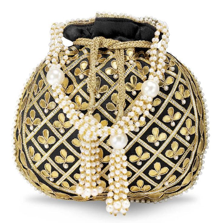 a decorative potli bag with a black and gold patterned design. the bag features a drawstring closure, pearl embellishments, and tassel accents.
