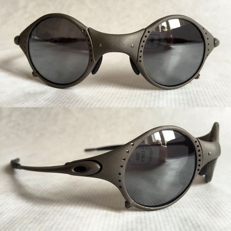 the image shows two angles of a pair of unique oakley sunglasses with round, gray lenses and a metal frame. the frame features rivets along the edges and a distinctive design. the top image shows a front view, and the bottom image shows a side view of the sunglasses.