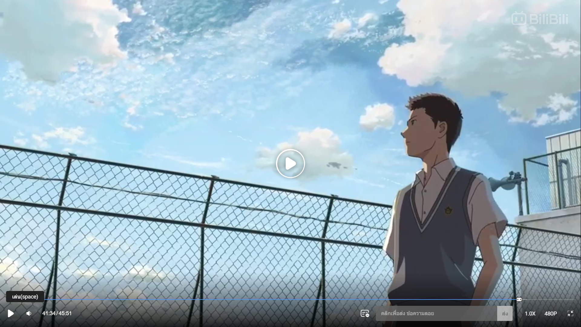 the image is a screenshot from an anime film or series. it features a teenage boy in a school uniform standing on a rooftop, looking out at a bright blue sky with fluffy white clouds.  he appears to be lost in thought. the low camera angle emphasizes the vastness of the sky and creates a sense of contemplation or longing.