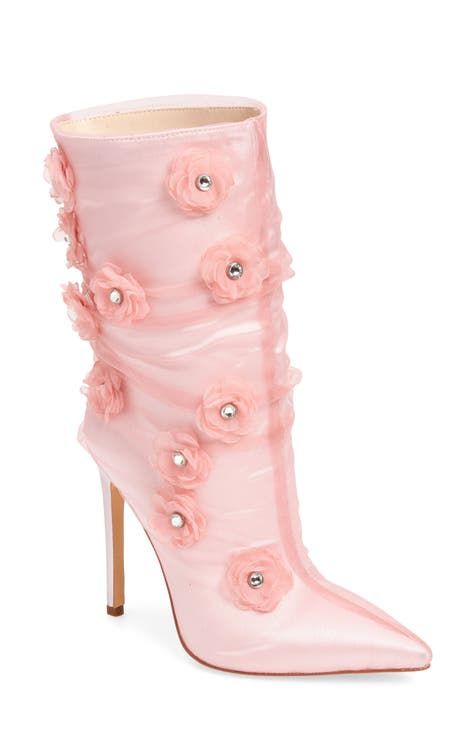 a single pink highheeled boot is displayed against a white background. the boot is adorned with floral embellishments, each containing a small, possibly rhinestone or pearllike center. the heel appears to be a stiletto style, and the overall material of the boot has a sheer, slightly translucent quality, giving it a delicate and ethereal appearance.