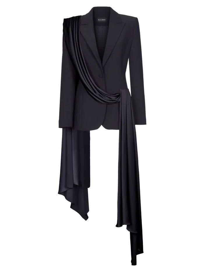 a black women's blazer with draped fabric across the front is centered on a white background.