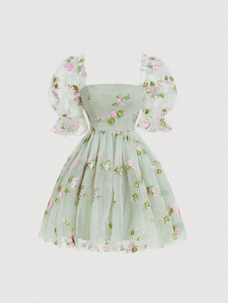 the image showcases a light green, aline dress with delicate pink and white floral embroidery. it features short, puffy sleeves and a fitted bodice. the dress falls to a flowing skirt that ends above the knee.