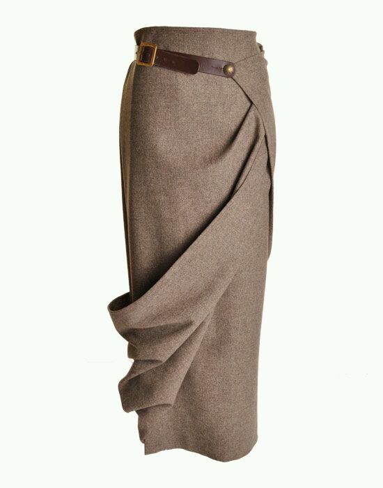 a brown highwaisted wrap skirt with pleats and a brown leather belt. the skirt is made of a wool fabric and has a flowy silhouette. it would be a great choice for a fall or winter outfit.