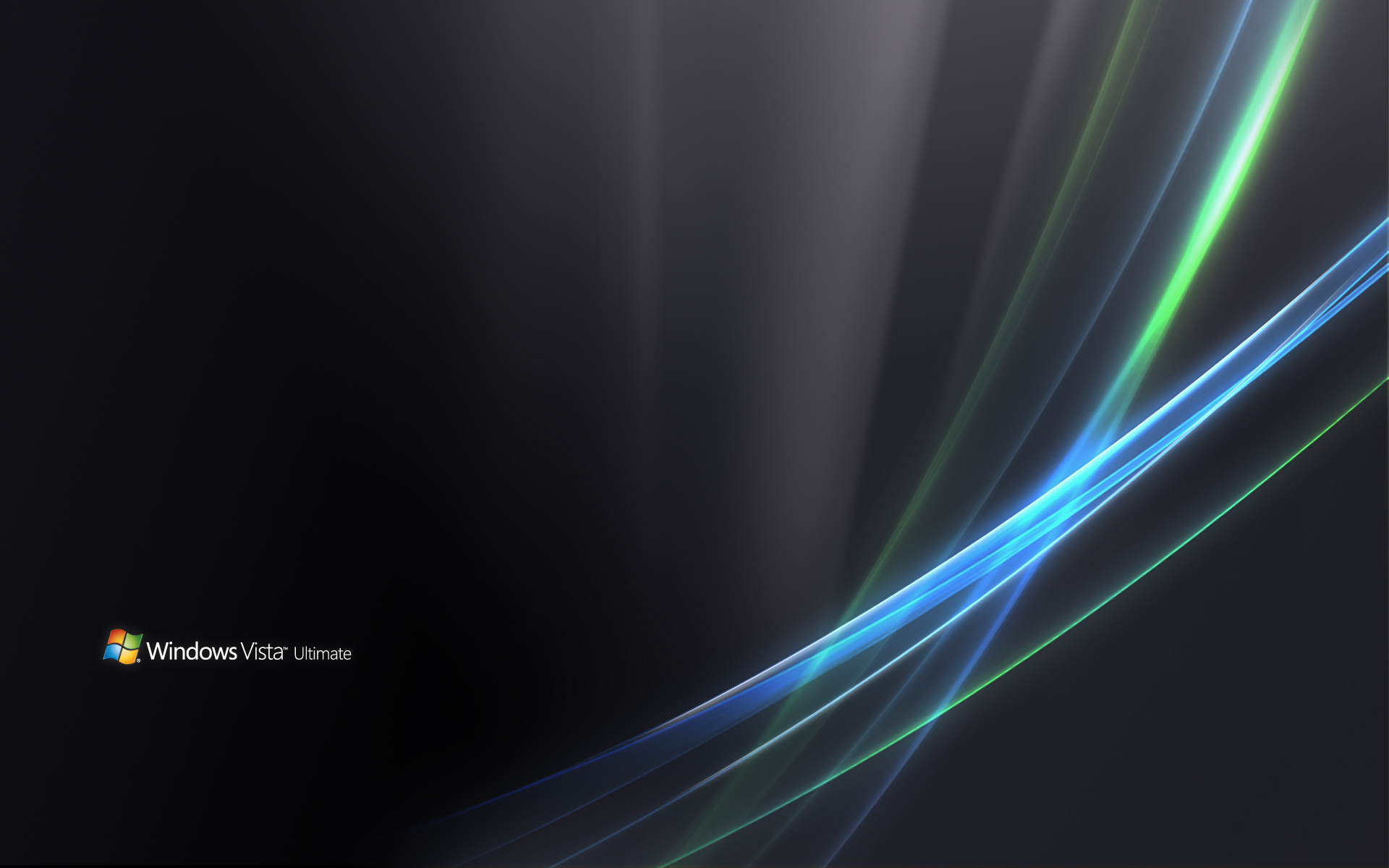 the image is the default wallpaper for windows vista ultimate. it features a black background with three glowing lines curving across the screen. the lines are predominantly blue, with hints of green and white. the windows vista logo is in the bottom left corner.