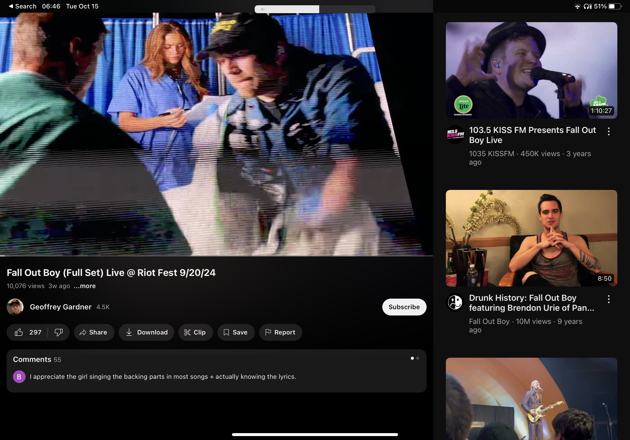 this image shows a youtube video of fall out boy performing live at riot fest. the video is on a mobile phone and the screen shows the band playing live.  the phone screen has youtube comments and other videos playing on the right side.  the comments are talking about how good the band sounds and how the female backup singer really knows her stuff.  the other video on the right is a music video for the band fall out boy, this video has a lot of views and has been up for a while.  the image overall shows a video of a live performance of fall out boy playing a concert.