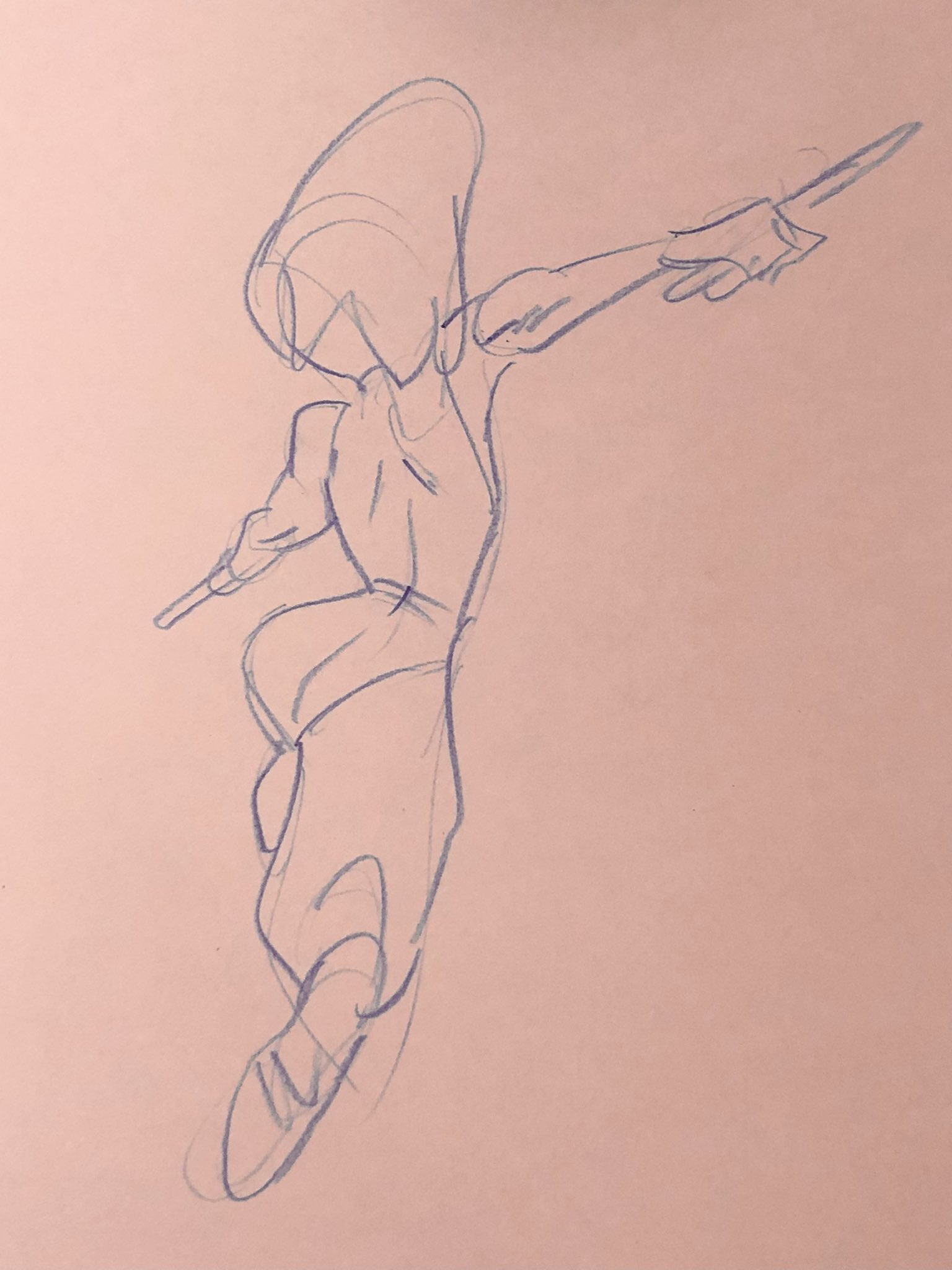 a blue pencil sketch on pink paper shows a figure in a dynamic, leaping pose. the figure holds what appear to be two short swords, one in each hand.  the figure is wearing baggy pants and has short hair. only a suggestion of facial features is included.