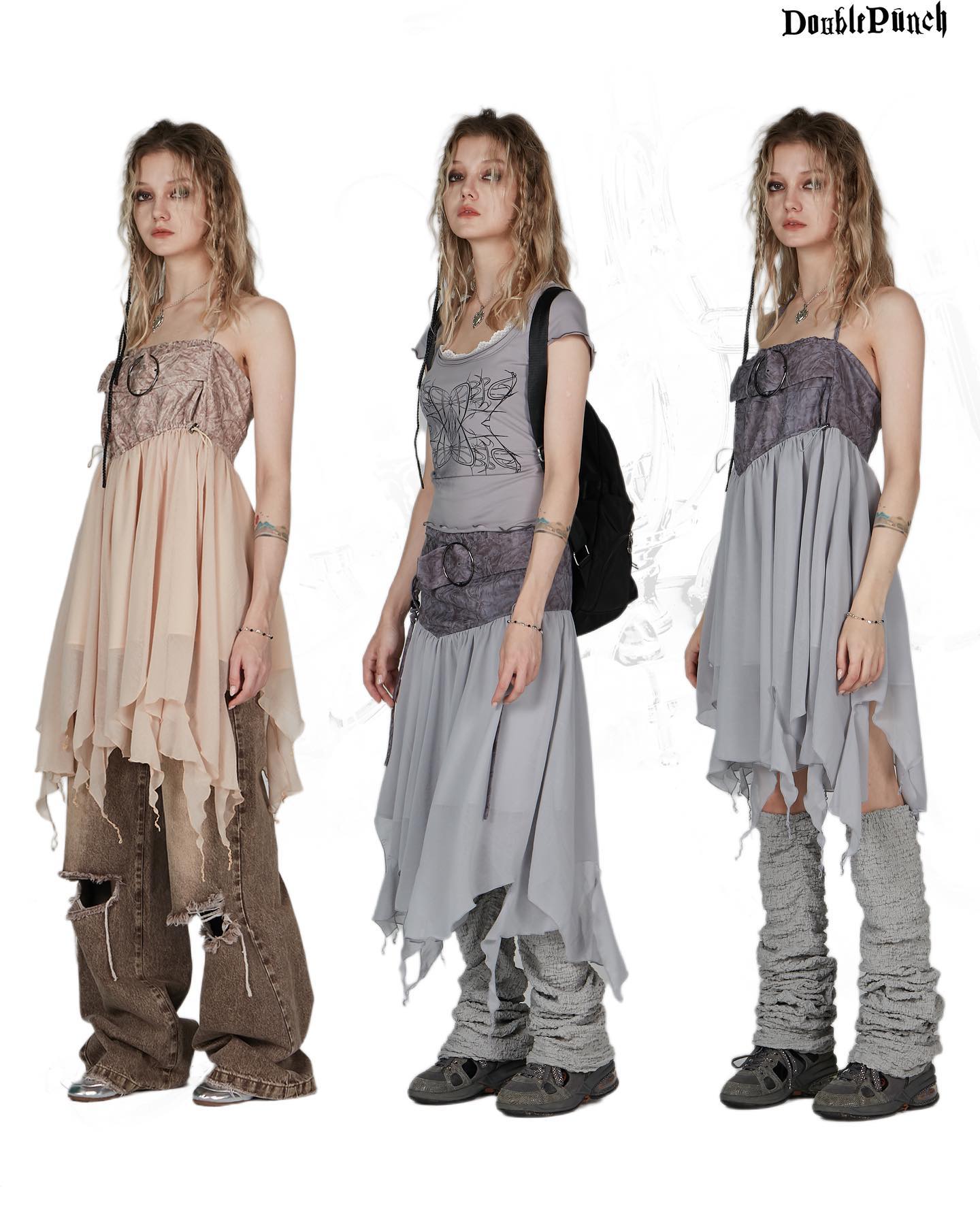 the image showcases three female models, each wearing a unique outfit from the "double punch" collection. the style leans towards bohemian, grunge, and alternative fashion.  each model is dressed in a layered, asymmetrical dress.  one model wears a beige dress, another a light gray dress, and the third also a gray dress but with different styling.  all three outfits are paired with distressed jeans and leg warmers. the background is simple and white, focusing attention on the clothing.  the image appears to be a professional fashion photoshoot.