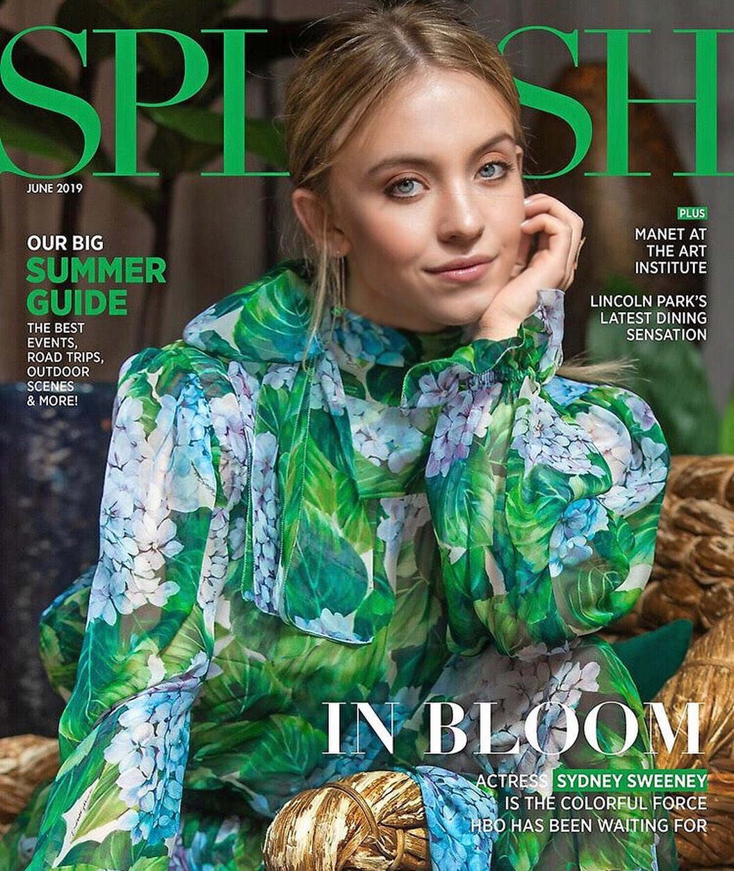 the image is the cover of splash magazine's june 2019 issue. it features actress sydney sweeney in a prominent closeup portrait. she is wearing a flowing, sheer green dress with a floral print. the background is subtly blurred, drawing focus to sweeney.  the cover design incorporates the magazine's title in large green lettering and includes text highlighting a "summer guide,"  mentioning an art exhibit (manet at the art institute), a dining establishment in lincoln park, and promoting sydney sweeney as a rising star on hbo.  the overall aesthetic is stylish and summery.