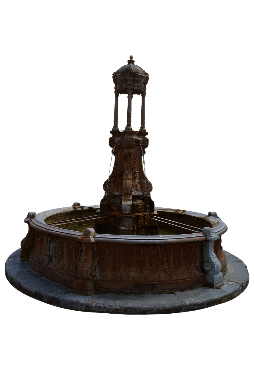 a full shot of a stone fountain in the middle of a black backdrop. the fountain is made of dark gray stone and has an ornate structure with a domed top. water is trickling down from the top section into a circular basin. the structure is surrounded by a stone platform.
