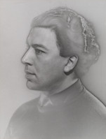 he image is a black and white, closeup portrait drawing or sketch of a man's head and shoulders. the style is realistic, with careful attention to detail in the facial features and hair. the man's expression is serious and contemplative. he is shown in profile, his gaze directed to the left of the frame. his hair is slightly wavy and combed back. he appears to be wearing a simple, darkcolored garment. the background is plain and unassuming, drawing focus to the subject. the overall tone is somber and muted, creating an atmosphere of quiet contemplation. the image's texture seems somewhat grainy, adding to its artistic quality.