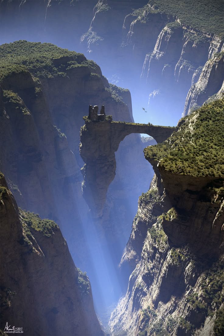 a scenic fantasy landscape featuring a deep canyon with rocky cliffs and green vegetation. a stone arch bridge connects two sections of the canyon, with ruins of a building at one end. sunlight streams through the canyon, creating an atmospheric effect. birds are visible in the blue sky.