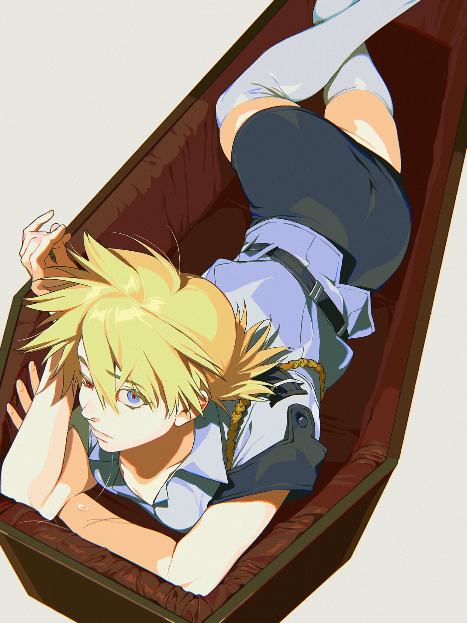 an anime character with blonde hair and blue eyes is lying down in a coffin. she is wearing thigh highs and a uniform.