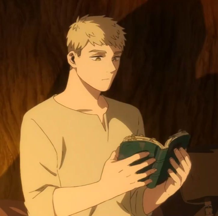 the image shows a young man with short blond hair and fair skin engrossed in reading a book. he's wearing a simple beige tunic.  the background is a warm, dark brown suggesting he might be inside a cozy space like a tent or cabin. the lighting is soft and warm, illuminating him from the side and casting a gentle shadow on the wall behind.