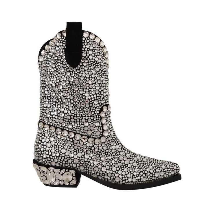 the image shows a single cowboy boot, heavily embellished with rhinestones. the boot is predominantly silver due to the rhinestones, with a black lining visible at the top. the heel is also covered in larger, irregularly shaped rhinestones. the boot is isolated on a white background.