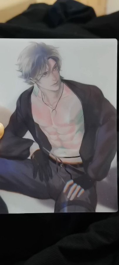an anime illustration of a man in a black jacket and pants, sitting with his arms relaxed on his lap and looking at the viewer. he has short, white hair, a toned body and is wearing a silver chain necklace.