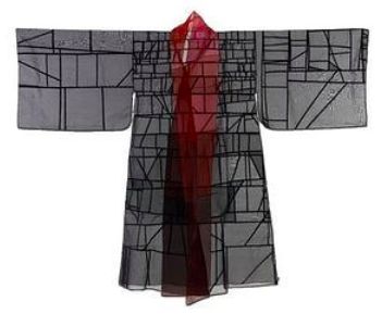 a gray and black geometric pattern kimono with a red sheer panel down the center.