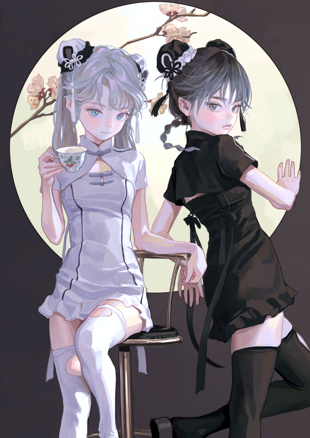 two animestyle girls are depicted in a painting. the girl on the left has pale skin, lightcolored hair styled in buns with ribbons, a short white dress with black trim, and white socks with cutouts. she's holding a tea cup. the girl on the right has slightly darker skin, black hair styled in buns with ribbons and a braid, and a short black dress with a tie. they're positioned in front of a full moon with flowering branches. the girl on the left is sitting on a chair, while the girl on the right is standing.
