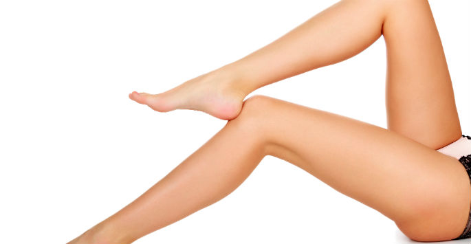 A pair of beautifully tanned legs after being treated to remove varicose veins