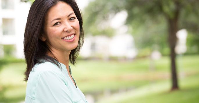 Close-up of an Asian woman in a park