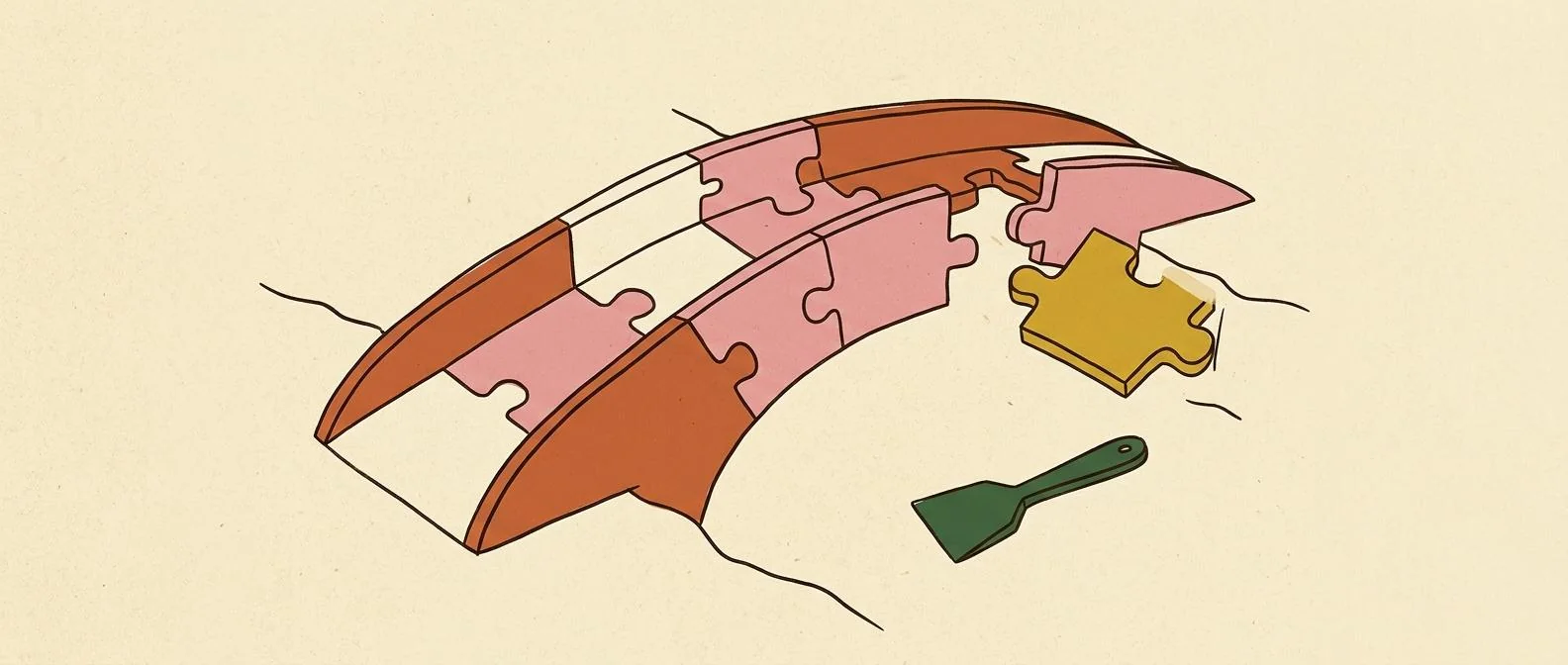 An almost-complete paper bridge with its final piece waiting nearby.