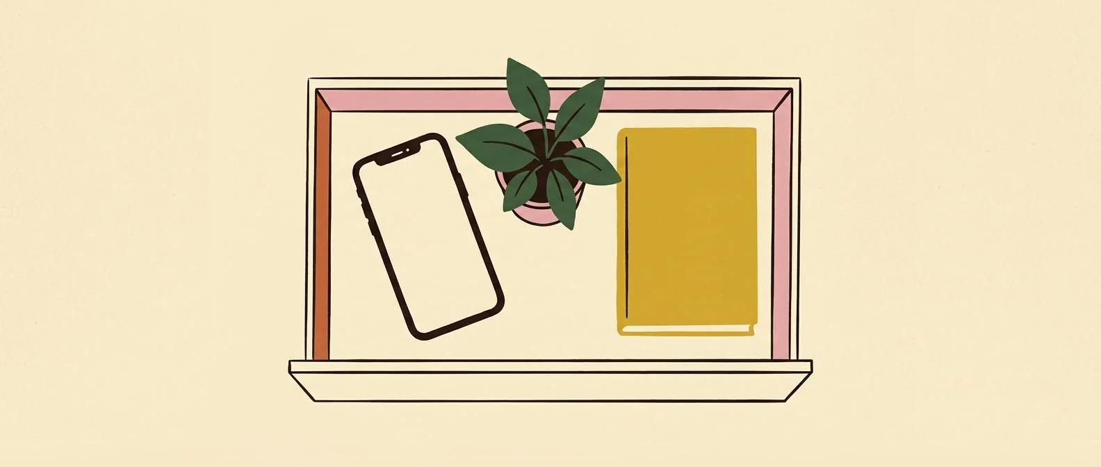 A phone, houseplant, and closed book resting in an open drawer.
