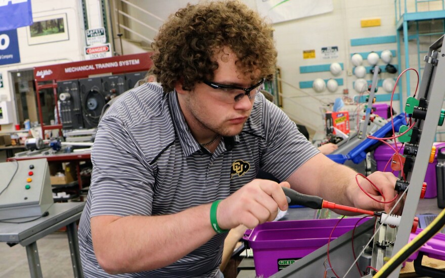 Trent Shaver, a student at Northeastern Junior College, builds a practice circuit in the wind tech lab. Electrical wiring is an important component of wind turbine technician training. Other parts of the curriculum include mechanical and hydraulics systems, computer programming and safety protocols.