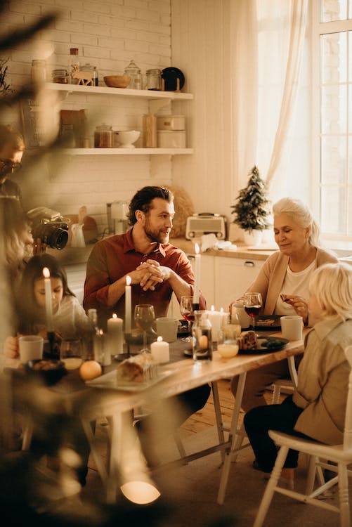 Free People Sitting Beside Table Stock Photo