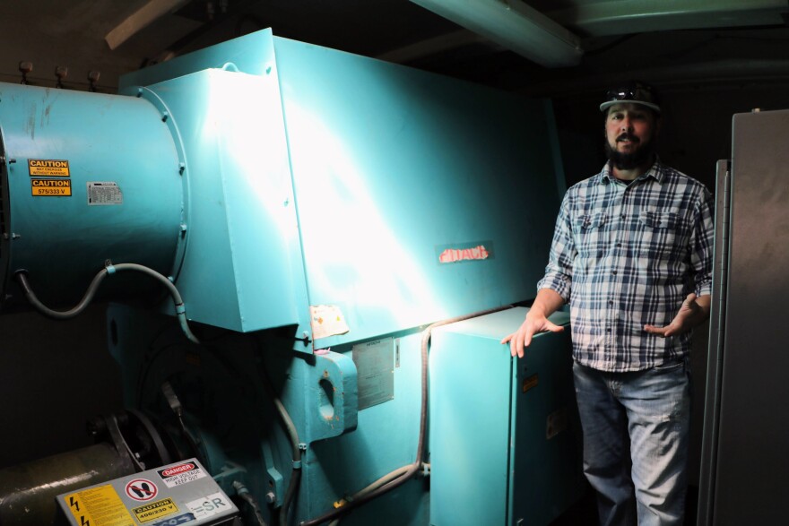 Jason Winter, an instructor in Northeastern Junior College's renewable energy program inside a simulation wind turbine outside the wind tech lab in Sterling, Colo. on April 8, 2024. The siml