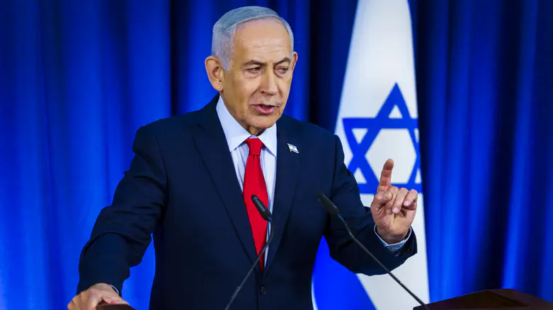 Prime Minister Benjamin Netanyahu speaking at a press conference on Saturday night, calling for a broad national government.