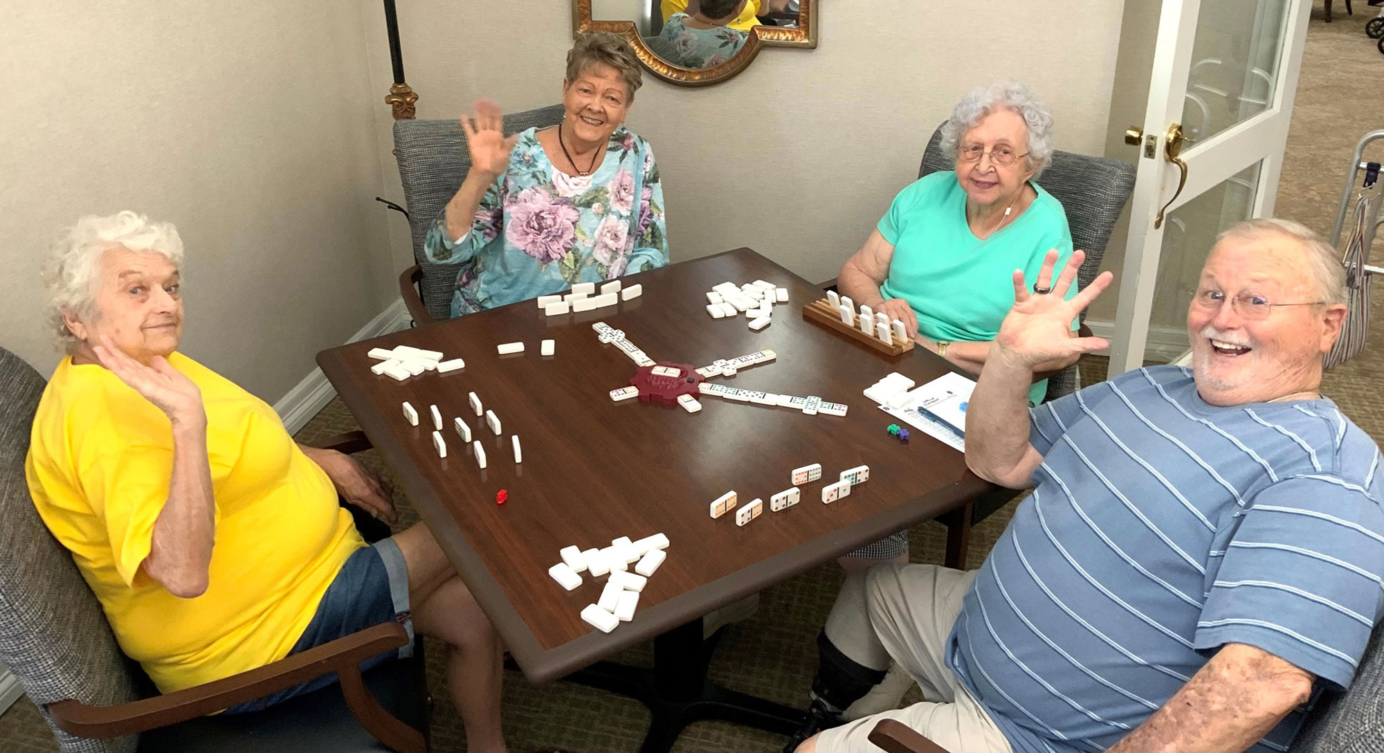residents enjoying a game of dominoes