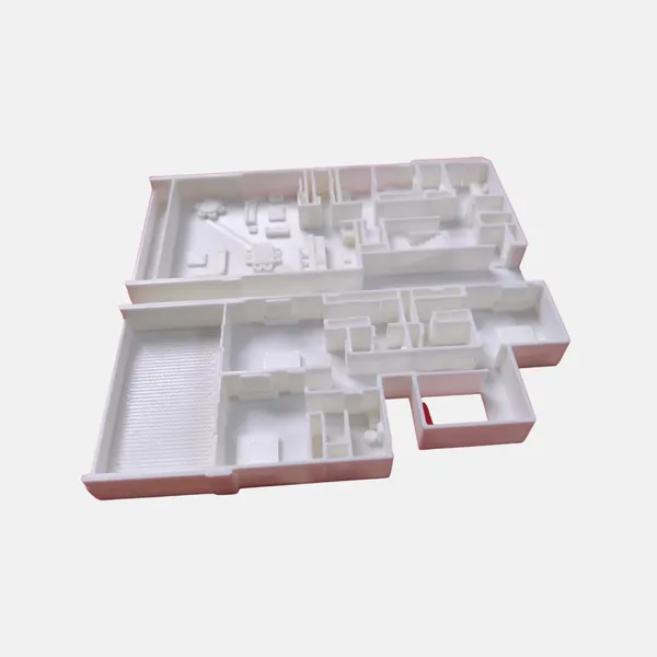 Maqueta arquitectónica de una casa impresa en 3D en blanco, fabricada sin moldes