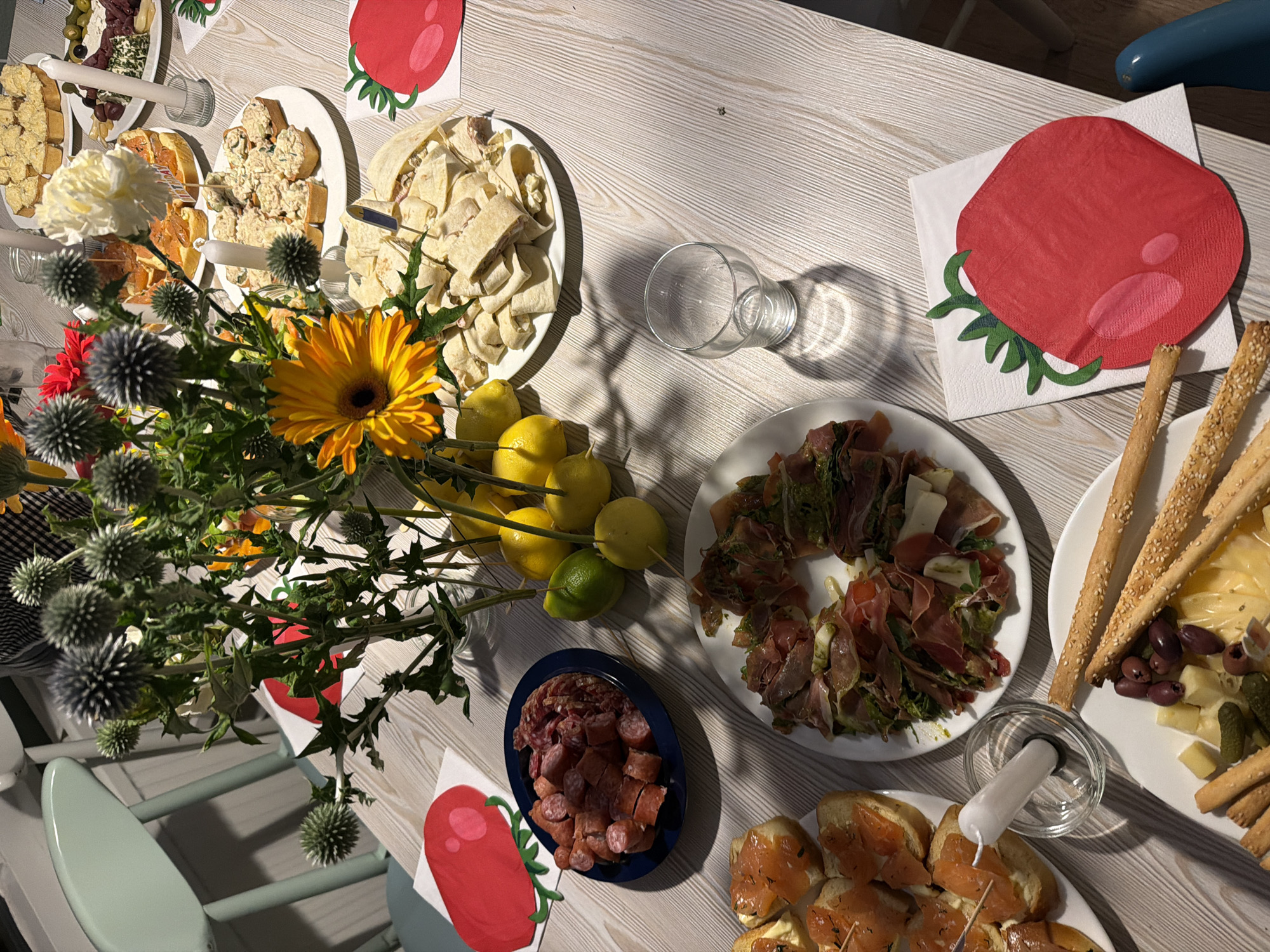 Birthday party in Heijen with food, flowers, and a cow costume