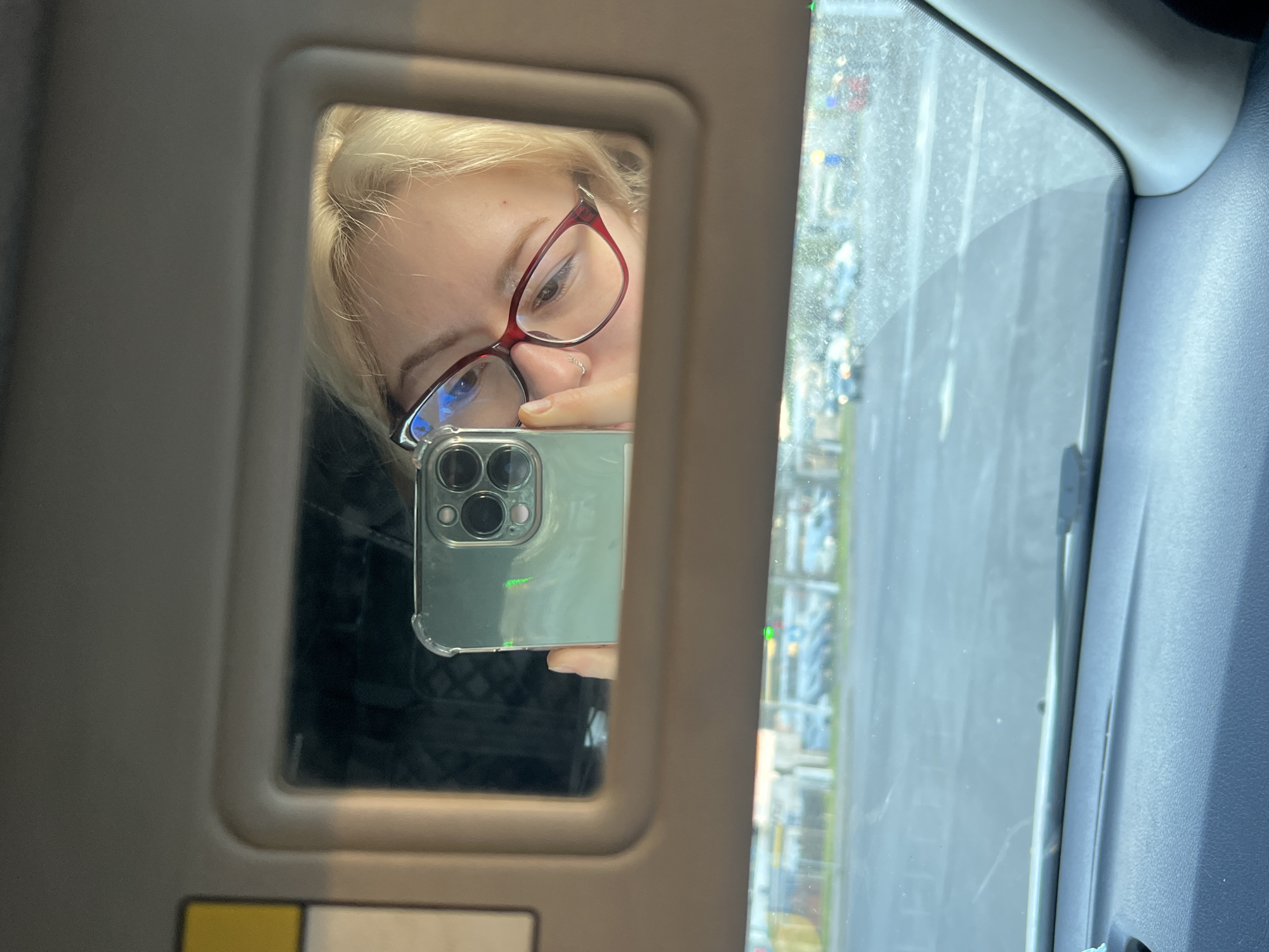 Person takes selfie near Ukrainian billboard in Odesa
