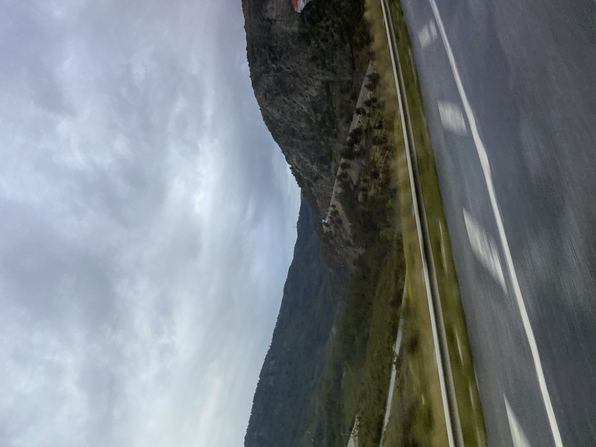 Mountain road observed under overcast skies in Manavgat