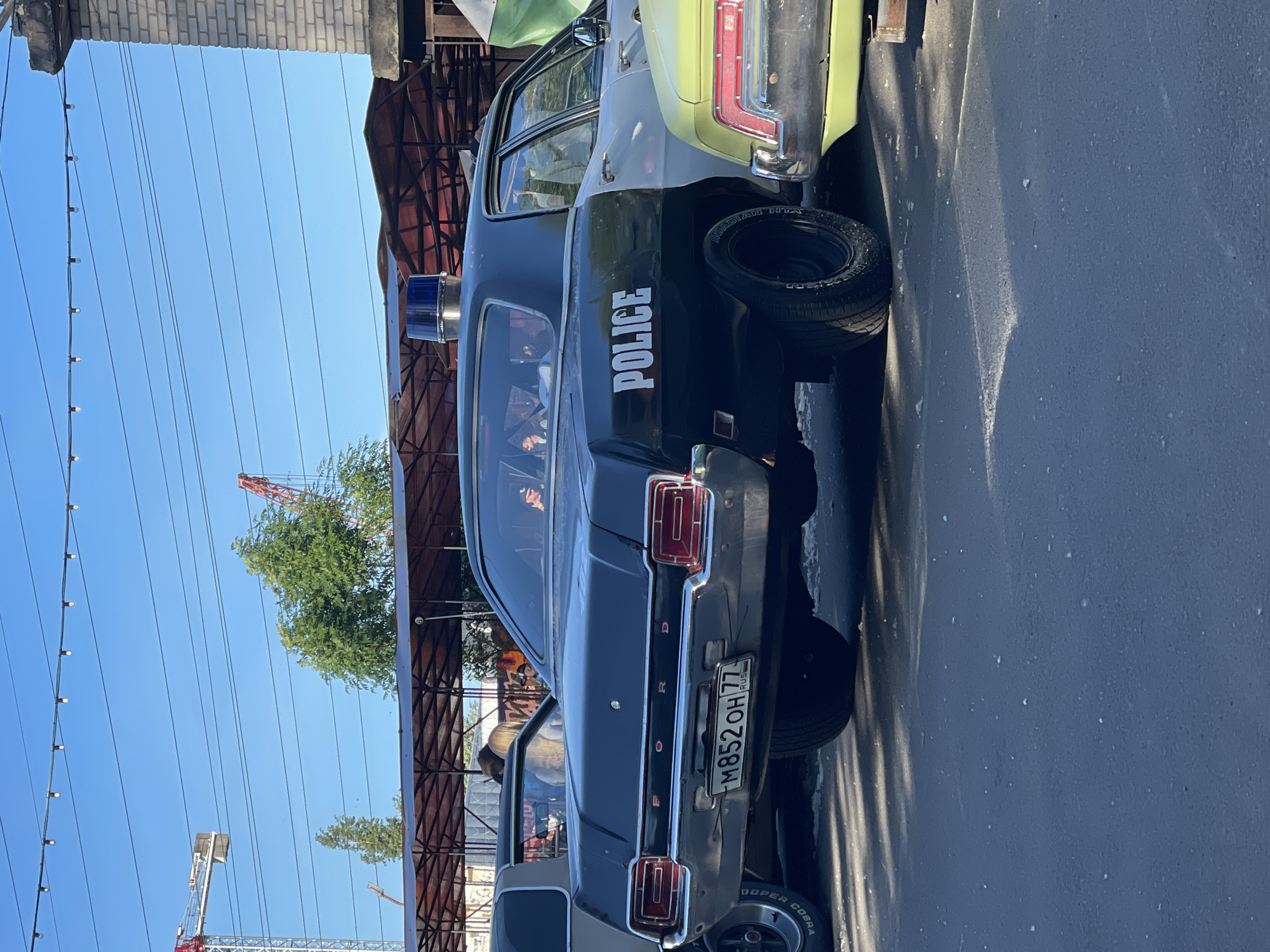 Vintage car meet rolls through Saint Petersburg on a summer afternoon