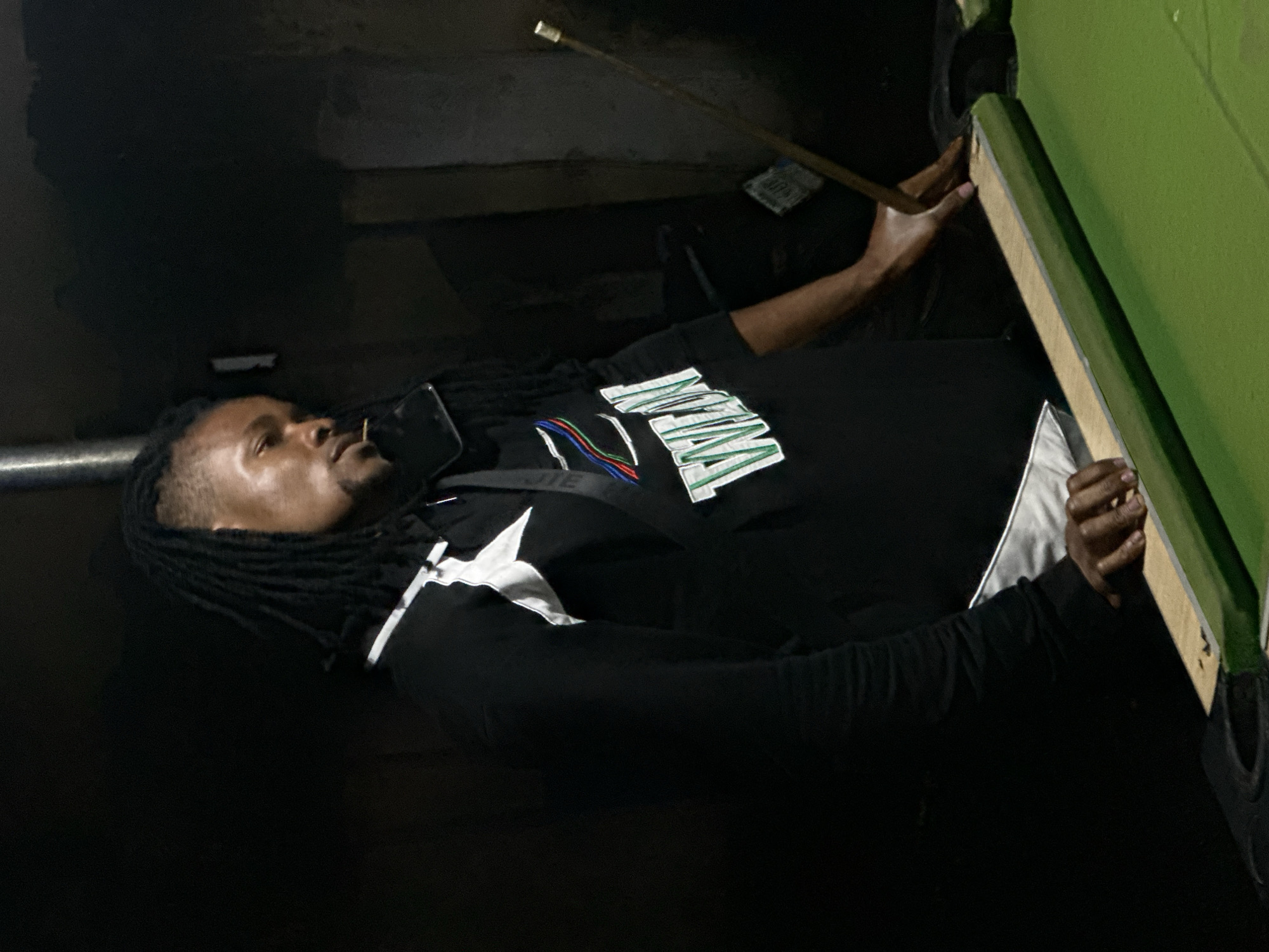 Two men play pool in Ogwashi-Uku, Nigeria