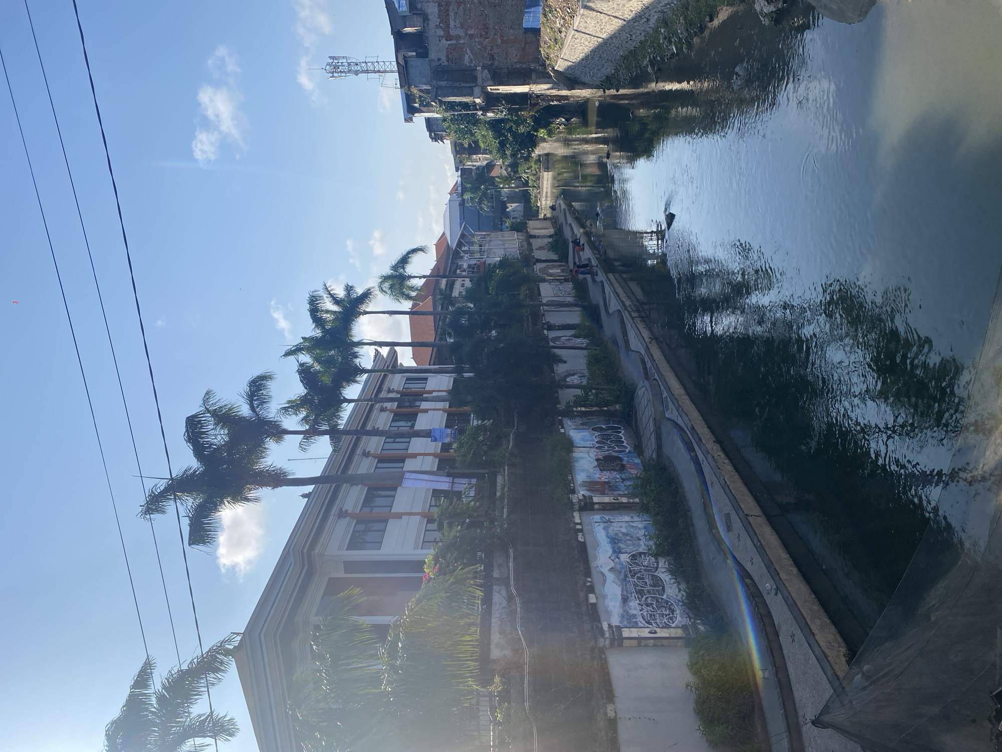 Street life, canals, and local commerce across Denpasar