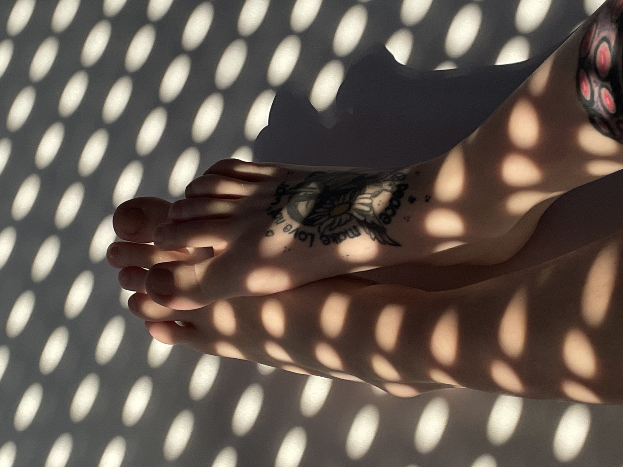 Dappled summer light and bare feet in a Belgrade apartment