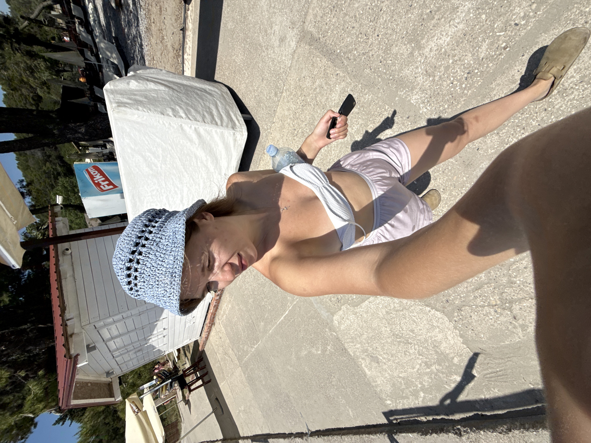 Beach day documentation captures woman, umbrellas, dining in Montenegro