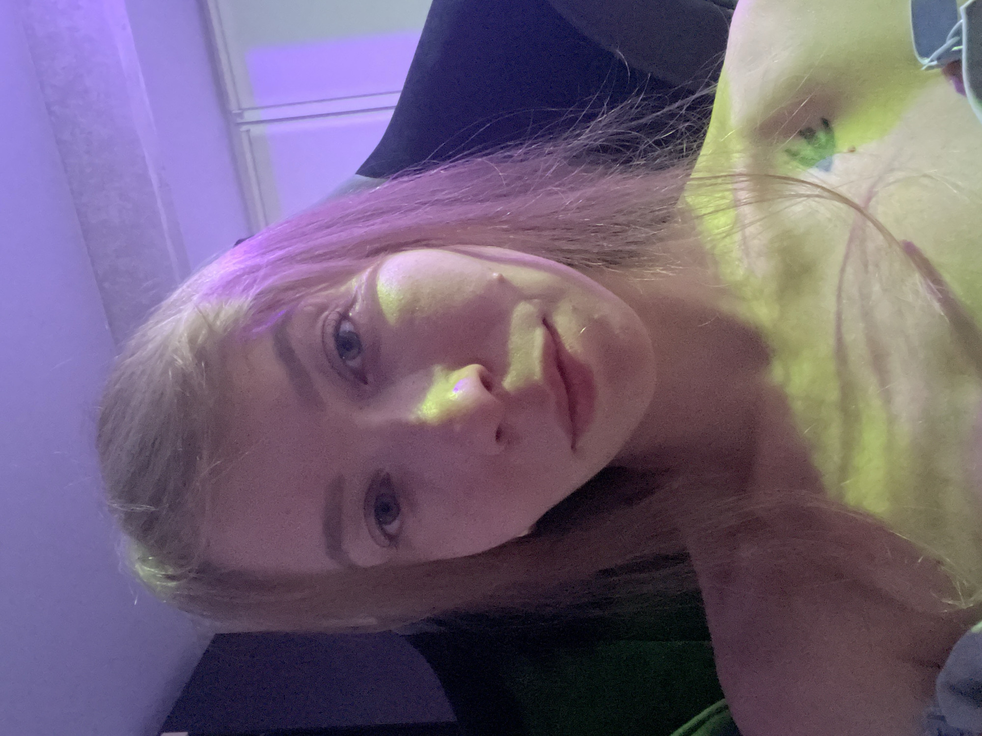 Indoor portraits captured in Perm under colored lighting