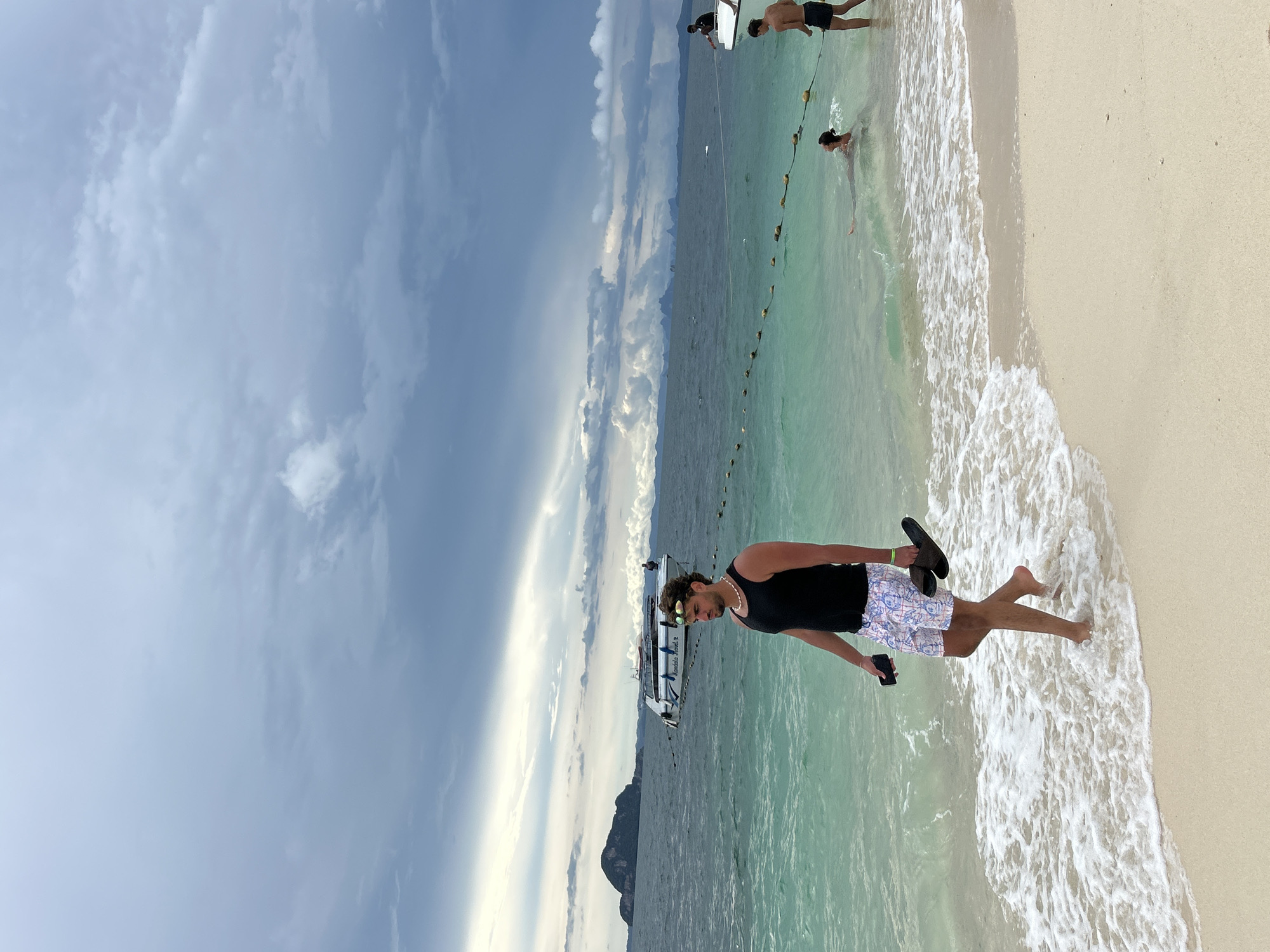 Busy tropical beach morning at Phru Nai, Thailand