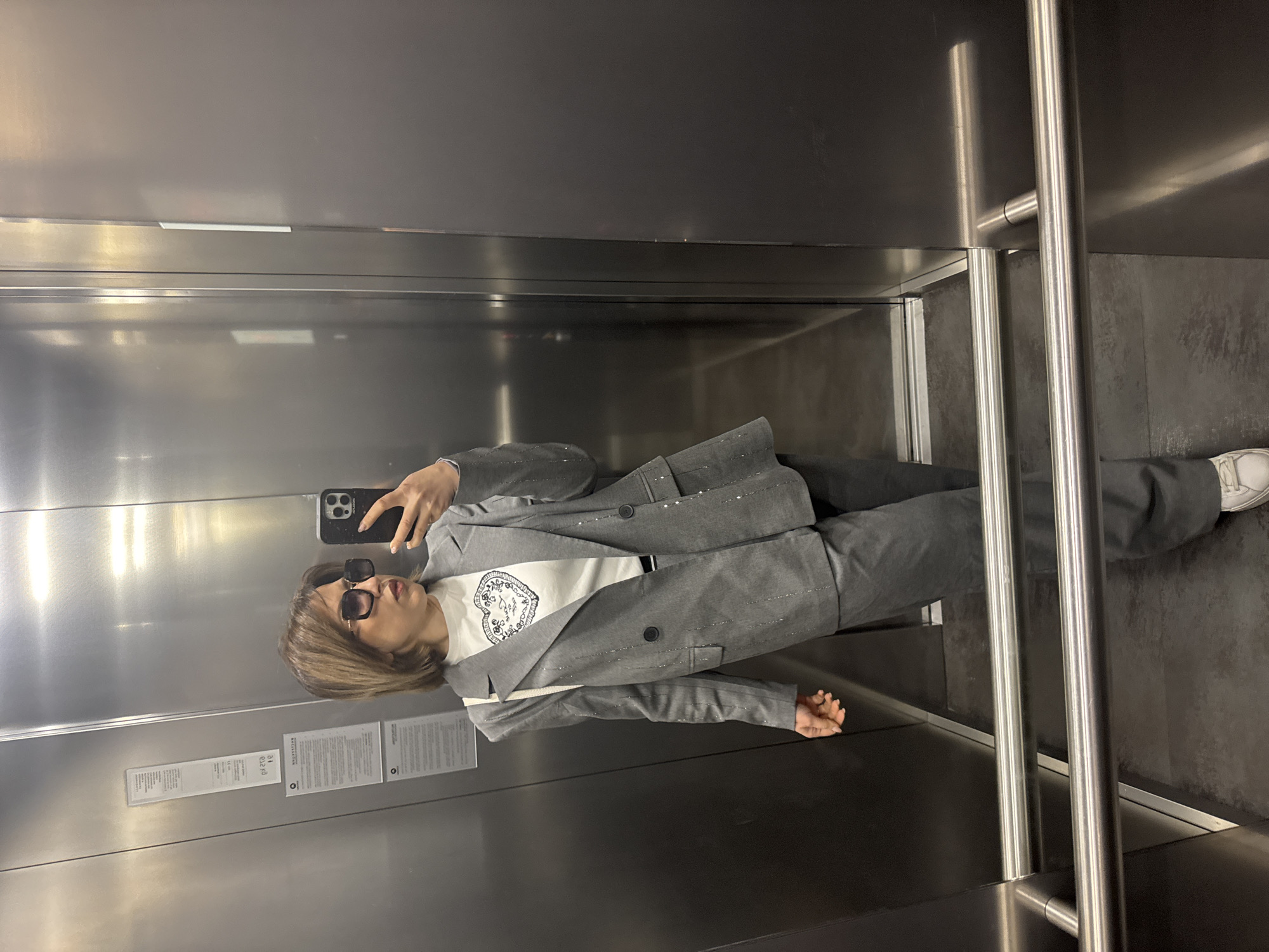 Woman takes elevator selfie in Sofia morning hours