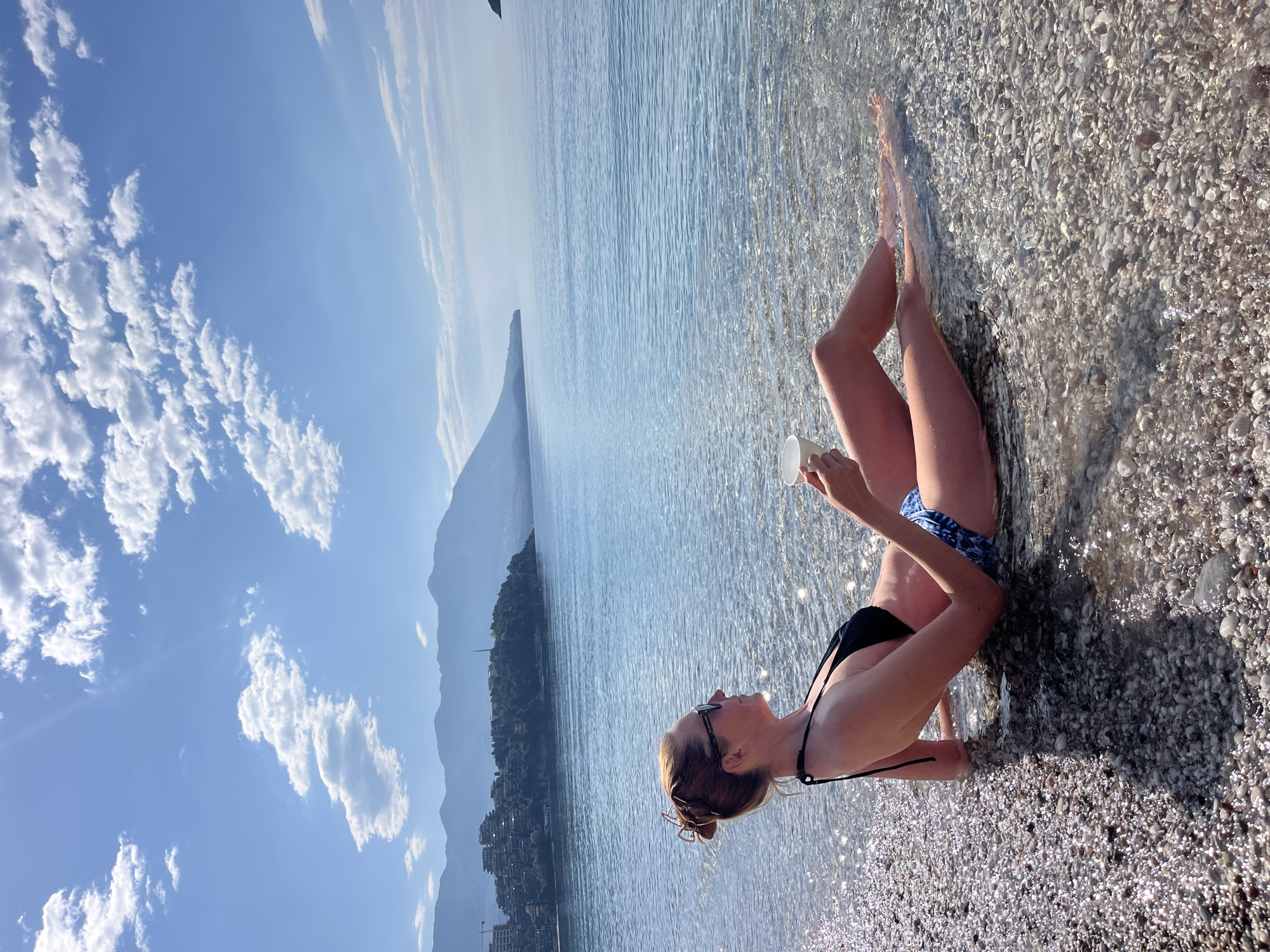 Woman enjoys morning beach moment in Budva, Montenegro