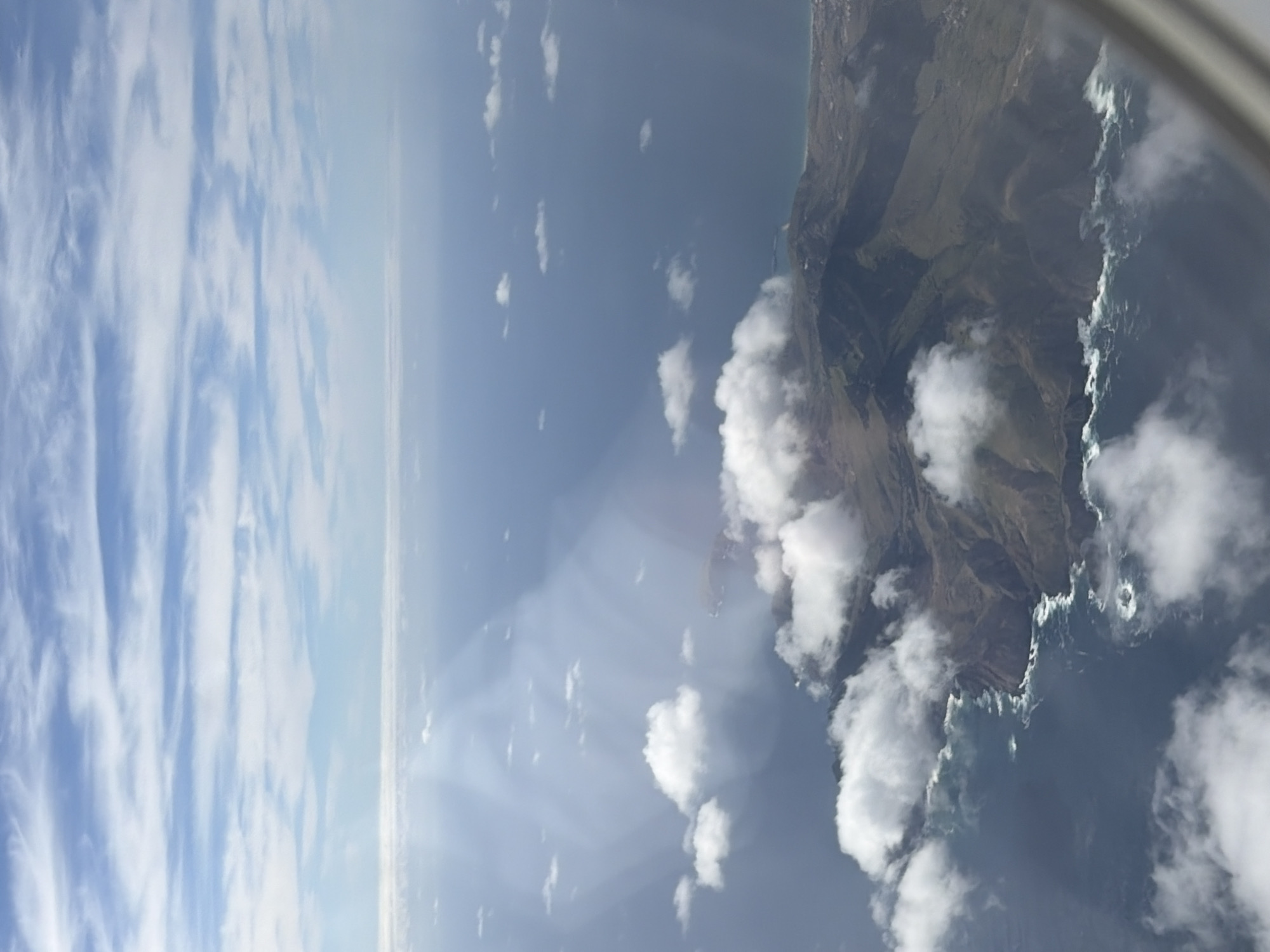 Aerial view captures Porto Moniz's rugged cliffs from aircraft